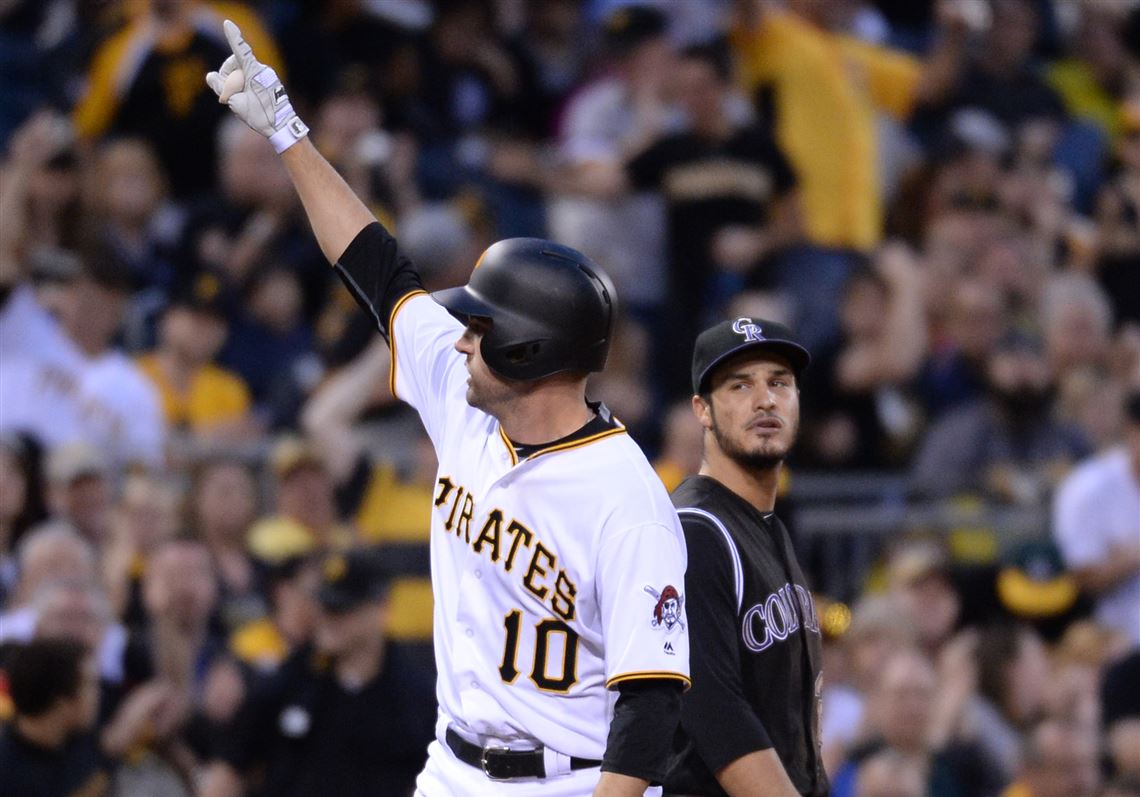 Pirates' Jordy Mercer celebrates after hitting a triple in the fifth inning against the Rockies Friday night at PNC Park.
