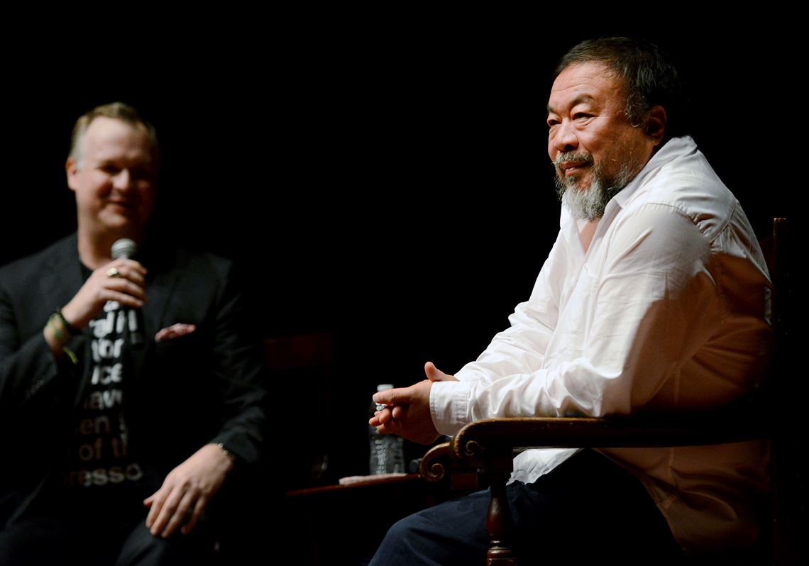 Chinese activist artist Ai Weiwei, right, speaks with Eric Shiner, director of The Andy Warhol Museum, during a forum held in the Carnegie Music Hall.
