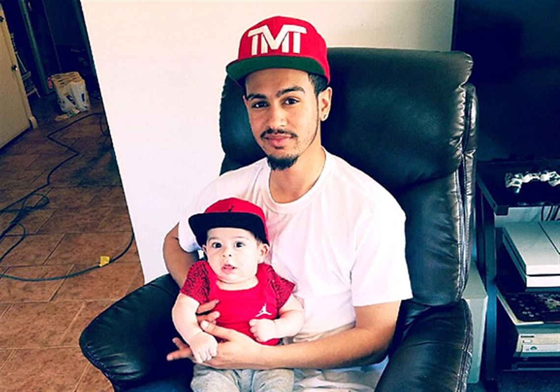 A prosecutor said today that a Weirton, W.Va., police officer was justified in the fatal shooting of Ronald D. Williams Jr., seen here holding son.
