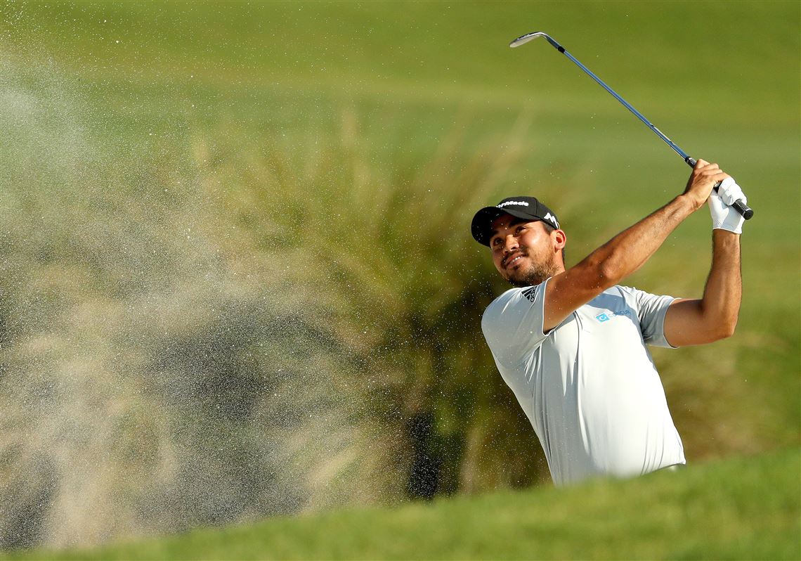 Jason Day of Australia plays a shot from a bunker on the 11th hole during the first round of THE PLAYERS Championship at the TPC Stadium course on May 12, 2016 in Ponte Vedra Beach, Florida.  