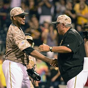 The Pirates' Ivan Nova is congratulated by manager Clint Hurdle after a 4-1 win Thursday against the Cincinnati Reds in Pittsburgh.