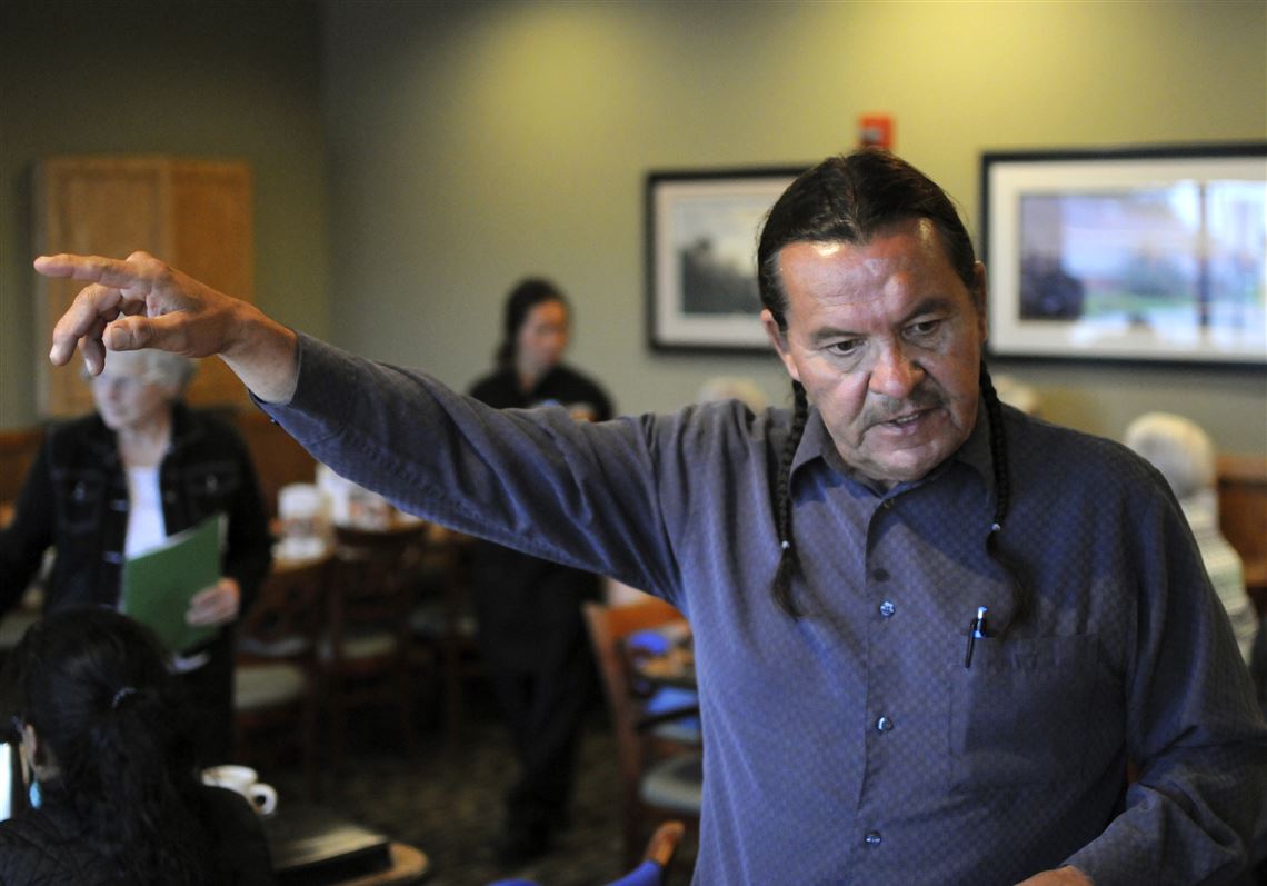 In this Sept. 12, 2016, photo, Democratic Public Utilities Commission candidate Henry Red Cloud speaks at a gathering of Democrats in Fort Pierre, S.D. Red Cloud is campaigning on a green energy platform against Republican Chris Nelson, who has served on the commission since 2011. (AP Photo/James Nord)