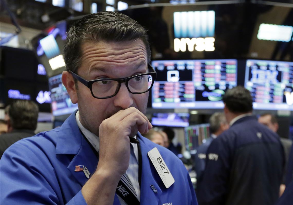 FILE - In this Monday, Sept. 26, 2016, file photo, trader Leon Montana works on the floor of the New York Stock Exchange. U.S. stock markets opened slightly higher Wednesday, Sept. 28, 2016, as energy companies are rising with the price of oil. (AP Photo/Richard Drew, File)