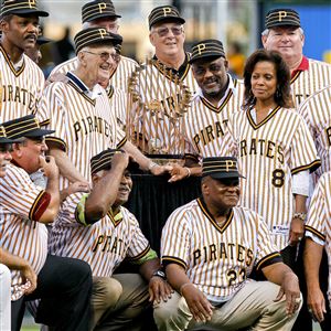 Members of the 1979 world championship Pirates pose with the World Series trophy at a 30th anniversary celebration. 