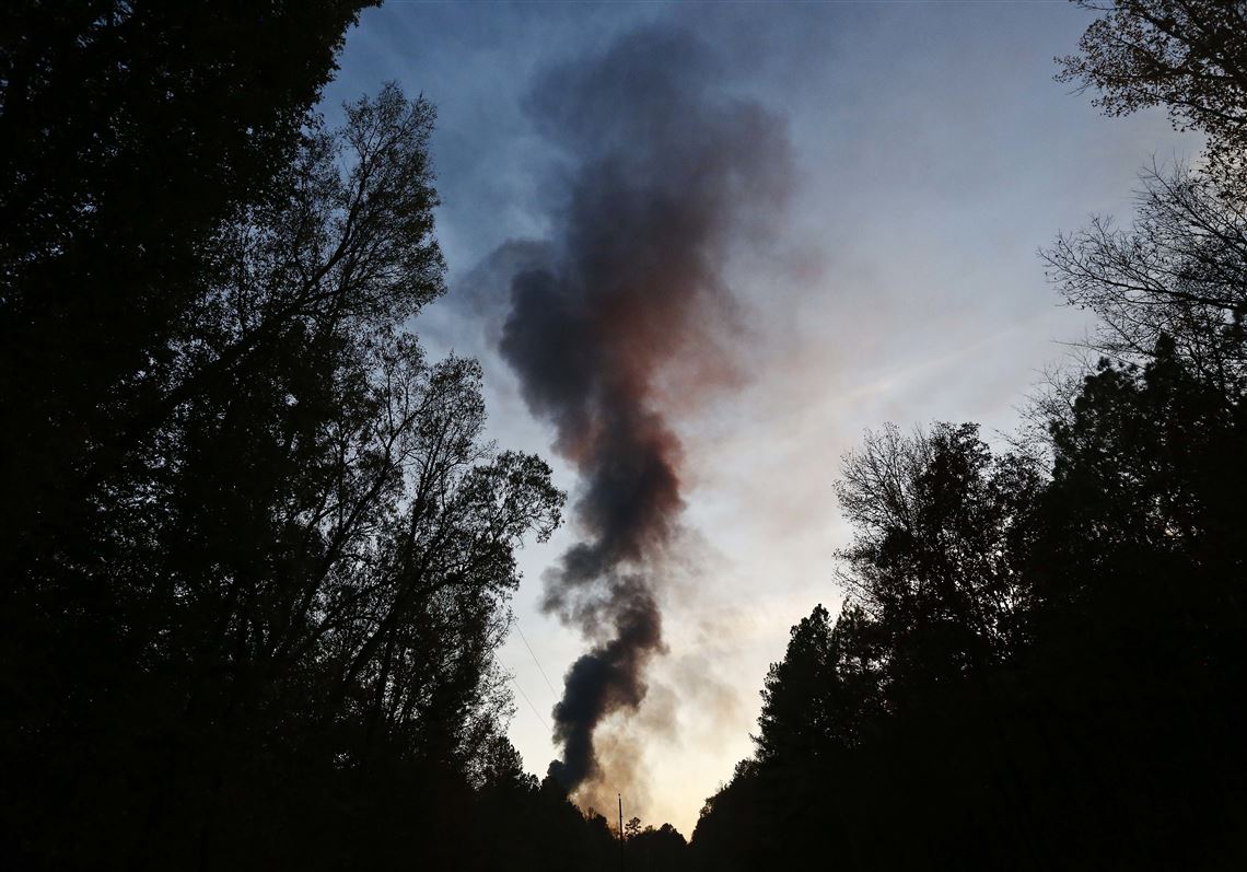 A plume of smoke rises from the site of an explosion on the Colonial Pipeline on Monday, Oct. 31, 2016, in Helena, Ala. Colonial Pipeline said in a statement that it has shut down its main pipeline in Alabama after the explosion in a rural part of the state outside Birmingham. (AP Photo/Brynn Anderson)