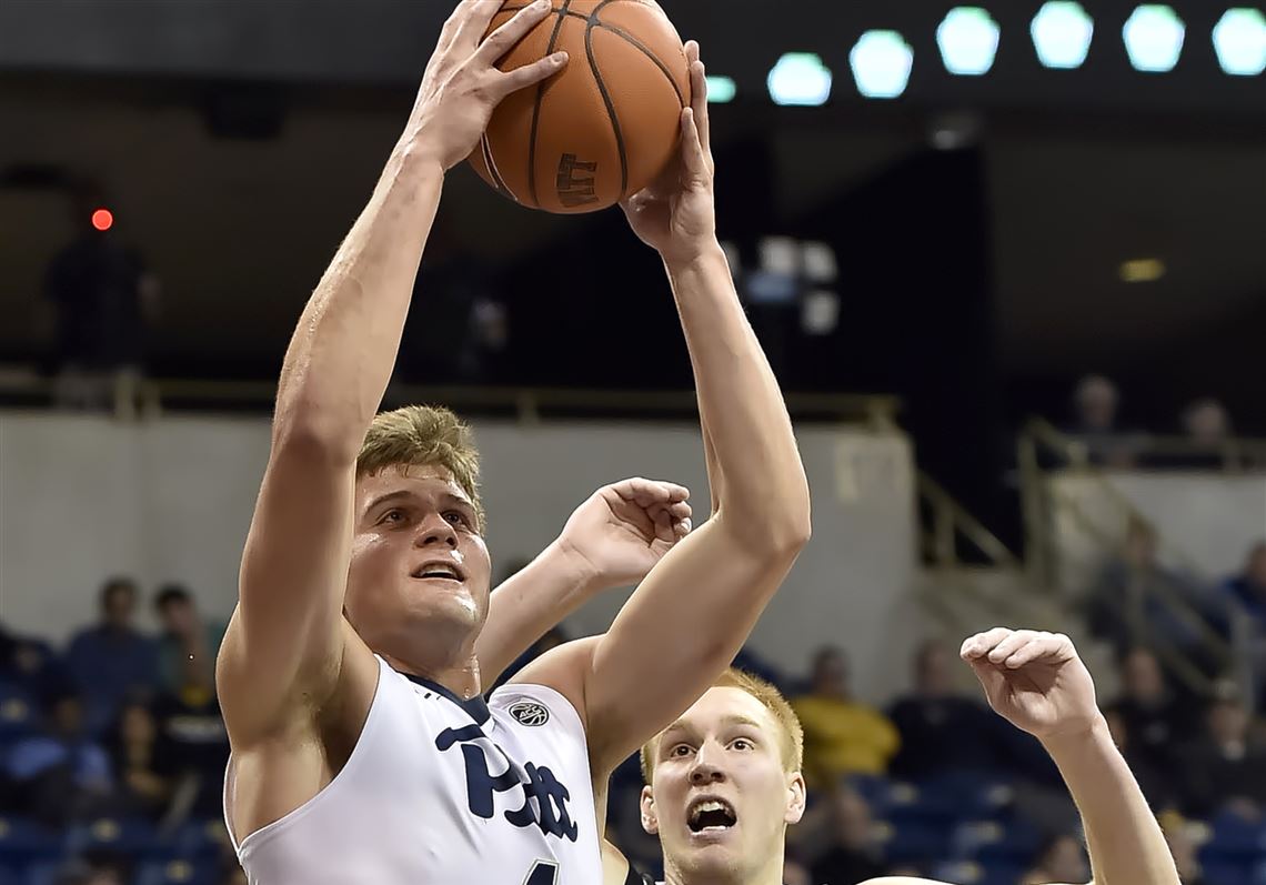 Pitt's Ryan Luther drives to the net against Omaha's Mitch Hahn in the first half Wednesday at Petersen Events Center.