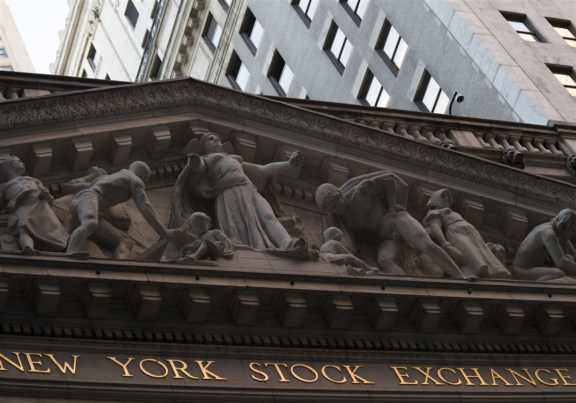 FILE - This Tuesday, Oct. 25, 2016, file photo shows the New York Stock Exchange at sunset, in lower Manhattan.  U.S. stock indexes moved higher in early trading Friday, Jan. 13, 2017 as investors pored over earnings reports from several big lenders. Banks and other financial companies were up the most. Utilities were the biggest laggard. Energy stocks also fell as crude oil prices headed lower. (AP Photo/Mary Altaffer, File)