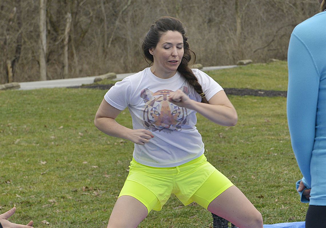 Jane Binakonsky runs through a series of conditioning and breathing exercises before entering  the icy water at Peters Lake Park.