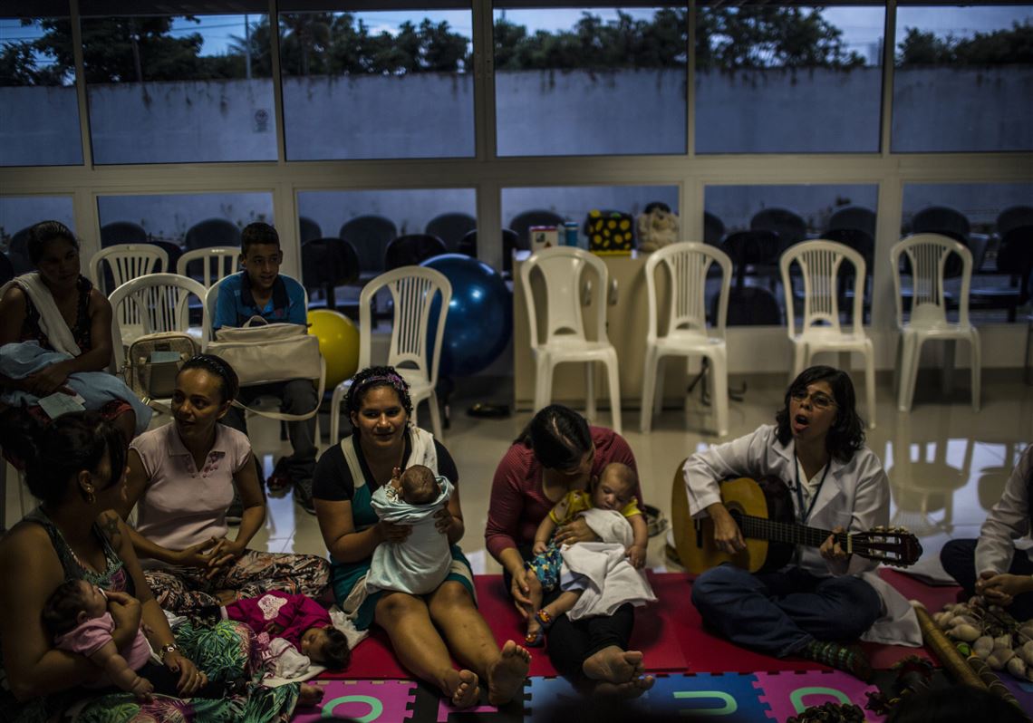 Relatives of patients suffering from microcephaly sing along with a sound therapist while gathering at the Altino Ventura Foundation in Recife, Brazil, on Feb. 18, 2016.