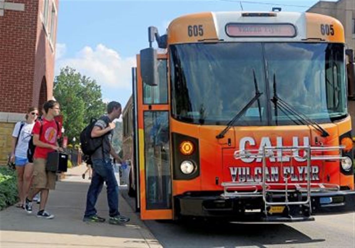 Cal U students board one of the Vulcan Flyers on the university's campus.