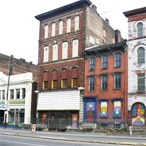 West North Avenue buildings on the North Side are, from left,  the Masonic Temple, the white terra cotta Garden Theater, the former Apache Lounge and two 19th century residential buildings.