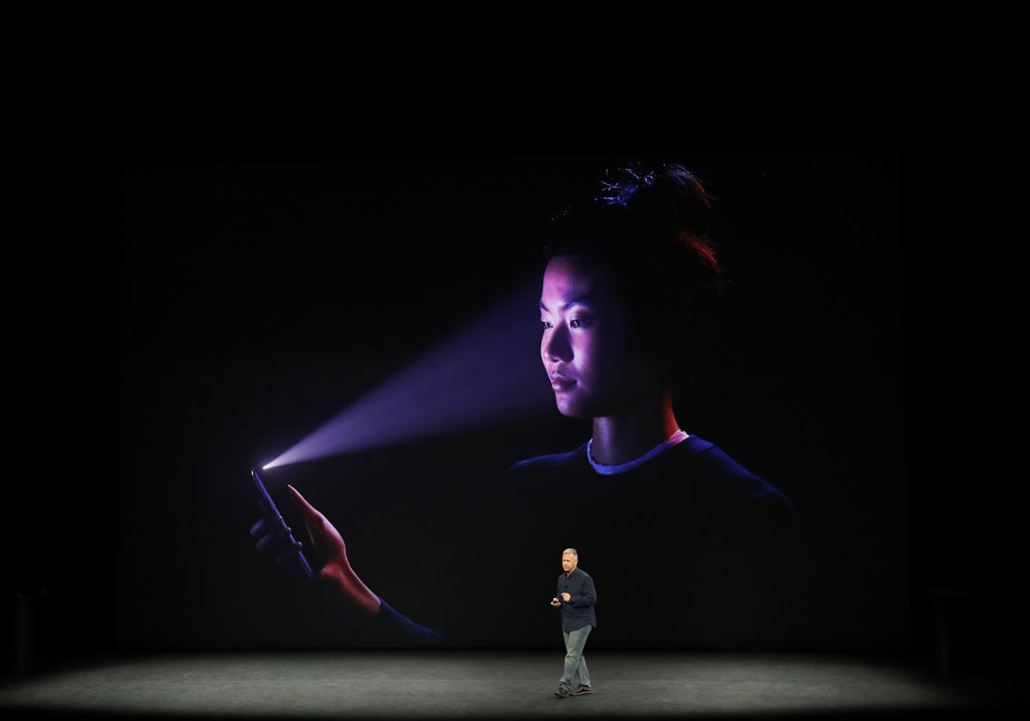 Phil Schiller, senior vice president of worldwide marketing at Apple, speaks about the Face ID feature to unlock the iPhone X during the company's event at the new Steve Jobs Theater in Cupertino, Calif., on Tuesday.