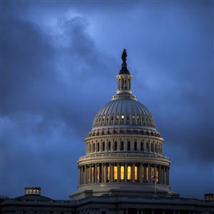The Capitol is seen at dawn as overnight storm clouds pass in Washington on Oct. 24, 2017.
