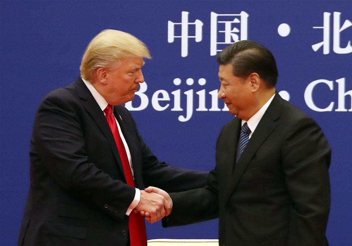 China's President Xi Jinping, center, U.S. President Donald Trump and first lady Melania Trump attend a state dinner at the Great Hall of the People in Beijing, China, Thursday, Nov. 9, 2017. (Thomas Peter/Pool Photo via AP)
