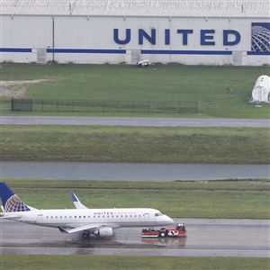  In thid August file photo, a United Airlines plane is towed at George Bush Intercontinental Airport in Houston.