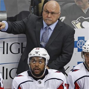 Washington Capitals coach Barry Trotz gives instructions during the third period of the team's NHL hockey game against the Pittsburgh Penguins in Pittsburgh, Sunday, April 1, 2018. 