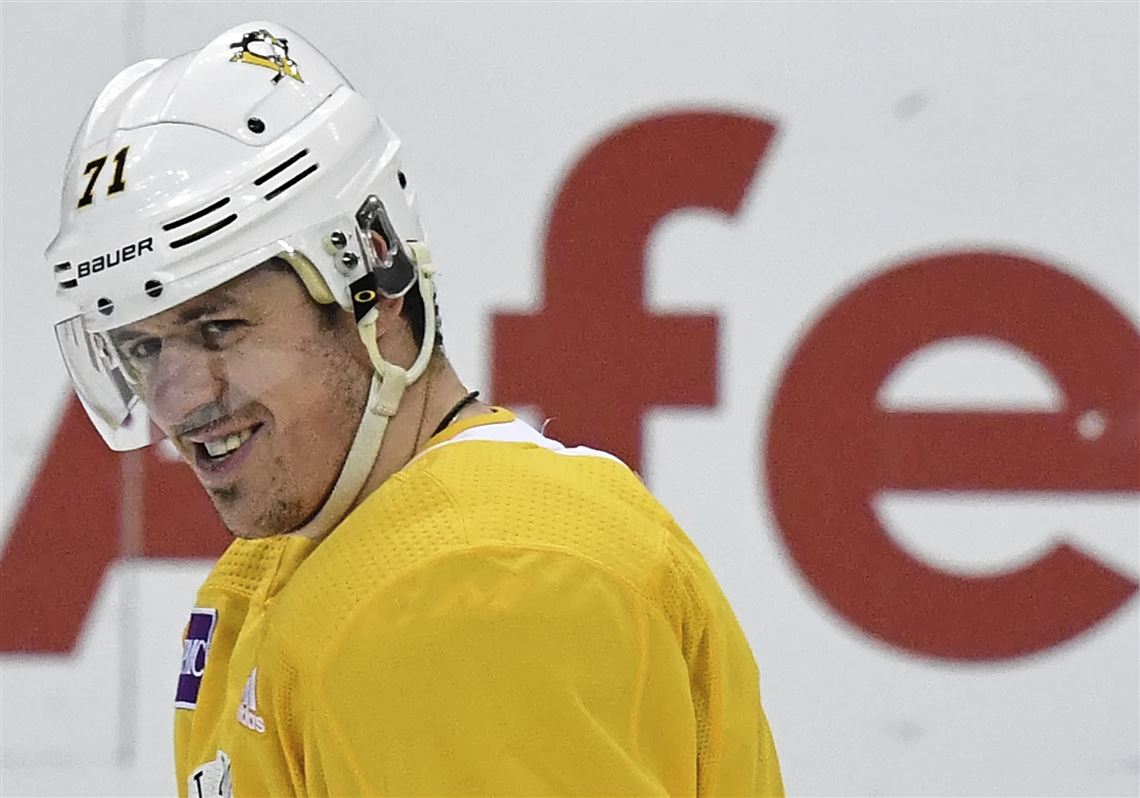Pittsburgh Penguins' Evgeni Malkin shares a laugh with Sidney Crosby during afternoon practice, Saturday, April 28, 2018 at the Capital One Arena Washington D.C. 