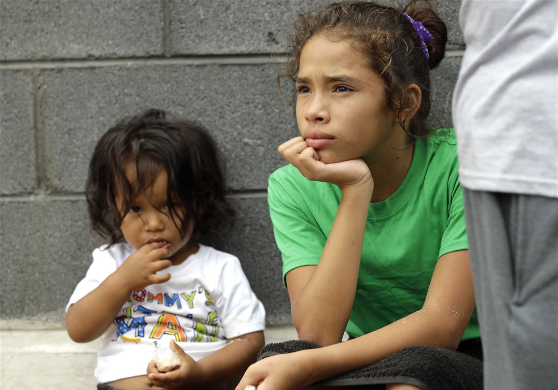 Angui Funes, right, sits with her brother, Jesus, after crossing the border back to Reynosa, Mexico, on June 21, 2018. Their family, who was seeking asylum, said they were told by officials they would be separated so they voluntarily returned to Mexico.