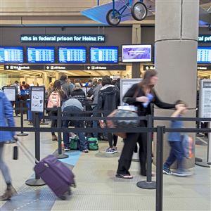Passengers wait in line at TSA check-in before boarding their flights on Wednesday, Nov. 15, 2017 at the Pittsburgh International Airport.