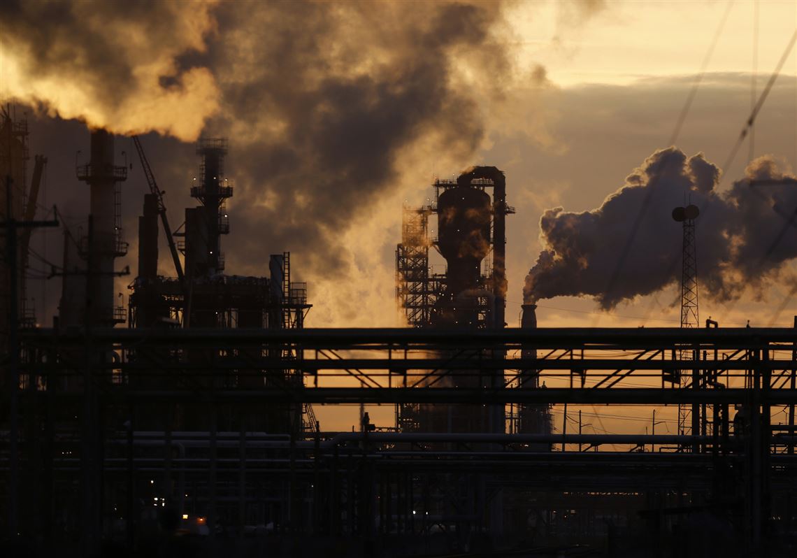 Emissions rise from the Royal Dutch Shell Norco Refinery in Norco, La.