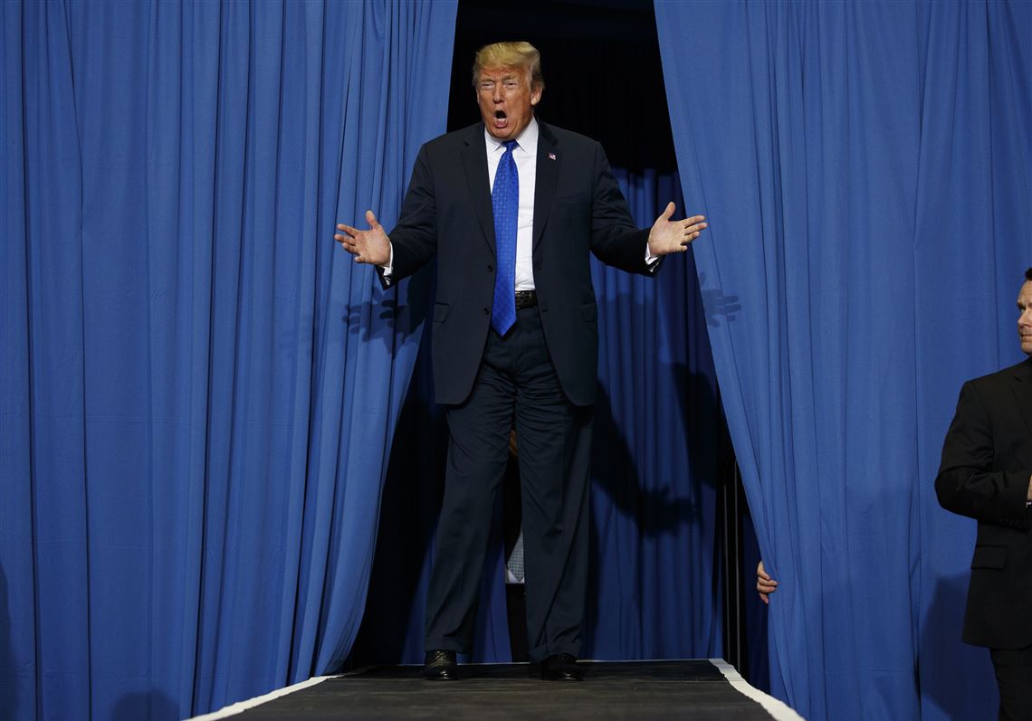 President Donald Trump arrives to speak at a campaign rally at the Landers Center Arena, Tuesday, Oct. 2, 2018, in Southaven, Miss. (AP Photo/Evan Vucci)