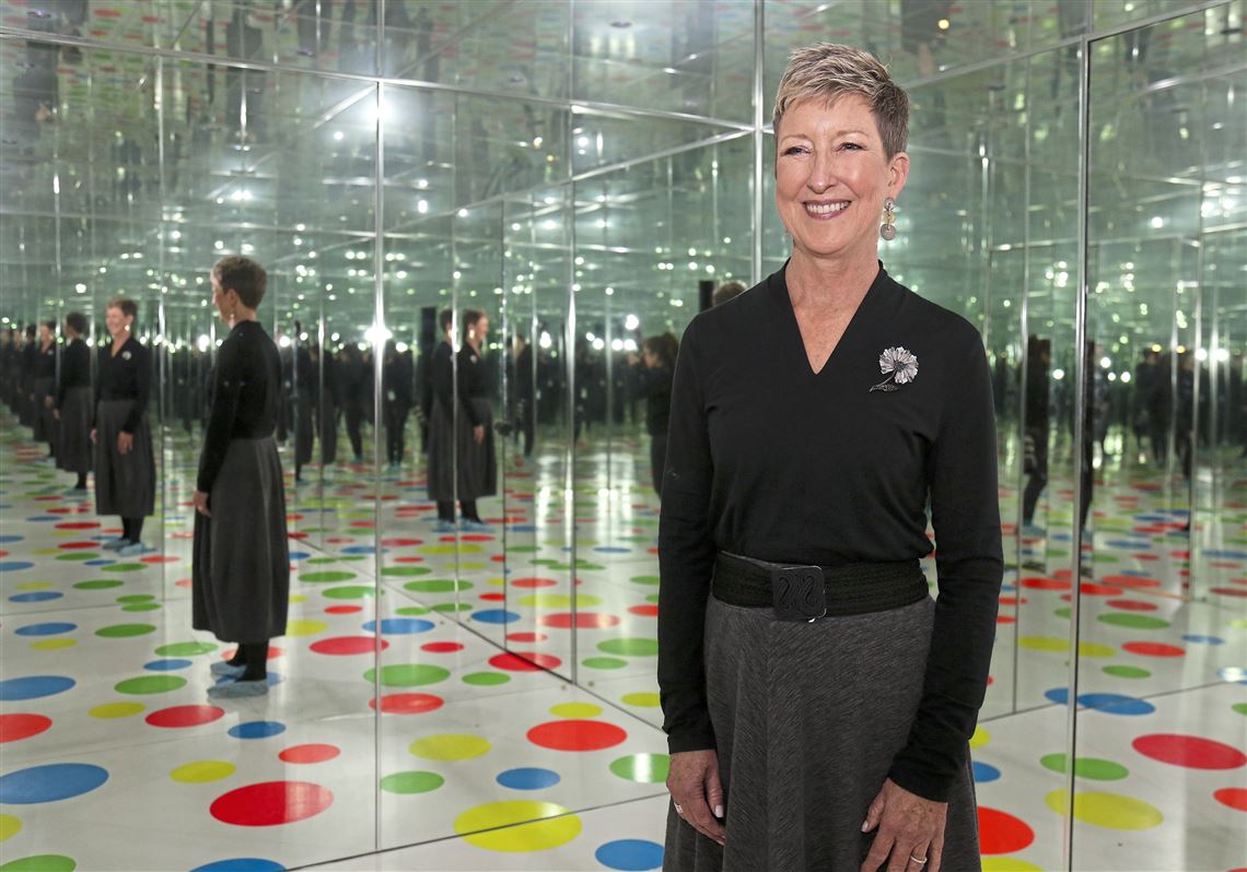  Judith Hansen O'Toole, new acting director of the Mattress Factory,  in the "Infinity Dots Mirrored Room" at the art museum on the North Side. 