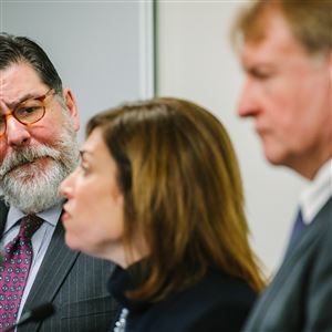 City of Pittsburgh Mayor William Peduto listens to Stefani Pashman, CEO of the Allegheny Conference on Community Development discuss the Amazon HQ2 bid at a press conference at the Allegheny County Courthouse on Thursday in Downtown.