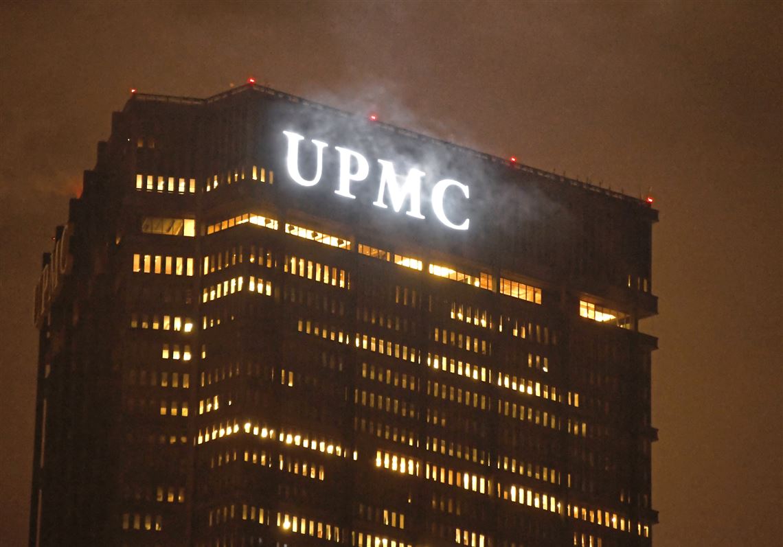 The UPMC sign atop the U.S. Steel Tower on a foggy morning, Thursday Jan. 24, 2019, Downtown.