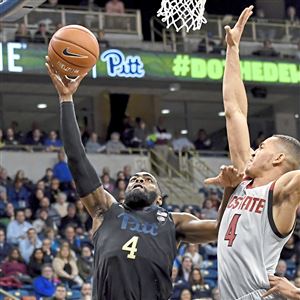 Pitt guard Jared Wilson-Frame drives to the net against NC State Jericole Hellems in the second half Saturday, Feb. 9, 2019, at Petersen Events Center. 