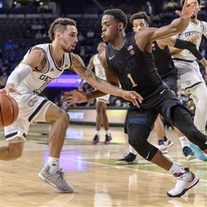 Georgia Tech guard Jose Alvarado (10) drives to the basket as Pittsburgh guard Xavier Johnson (1) defends during the first half of an NCAA college basketball game Wednesday, Feb. 20, 2019, in Atlanta. 