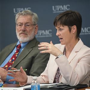 In this file photo, Department of Human Services (DHS) Acting Secretary Teresa Miller, right, talks beside Allegheny County Dept. of Human Services Director Marc Cherna during a round table discussion on Gov. Tom Wolf's response to the heroin and opioid epidemic at Wednesday, Nov. 8, 2017 at Magee-Womens Hospital of UPMC in Oakland. Miller on Feb. 21, 2019, called a first-of-its-kind report 
