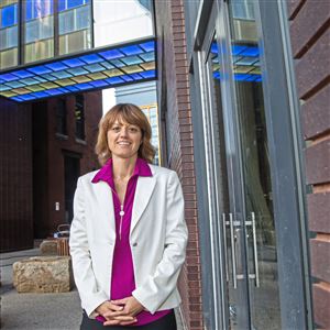 Bonnie Baxter, founder of the Doors Open tour, stands in front of Eighth and Penn on Friday, Sept. 27, 2019, Downtown. The building, being converted into apartments with the Sky Lounge and rooftop deck, will be one of 54 locations on the tour this year. 