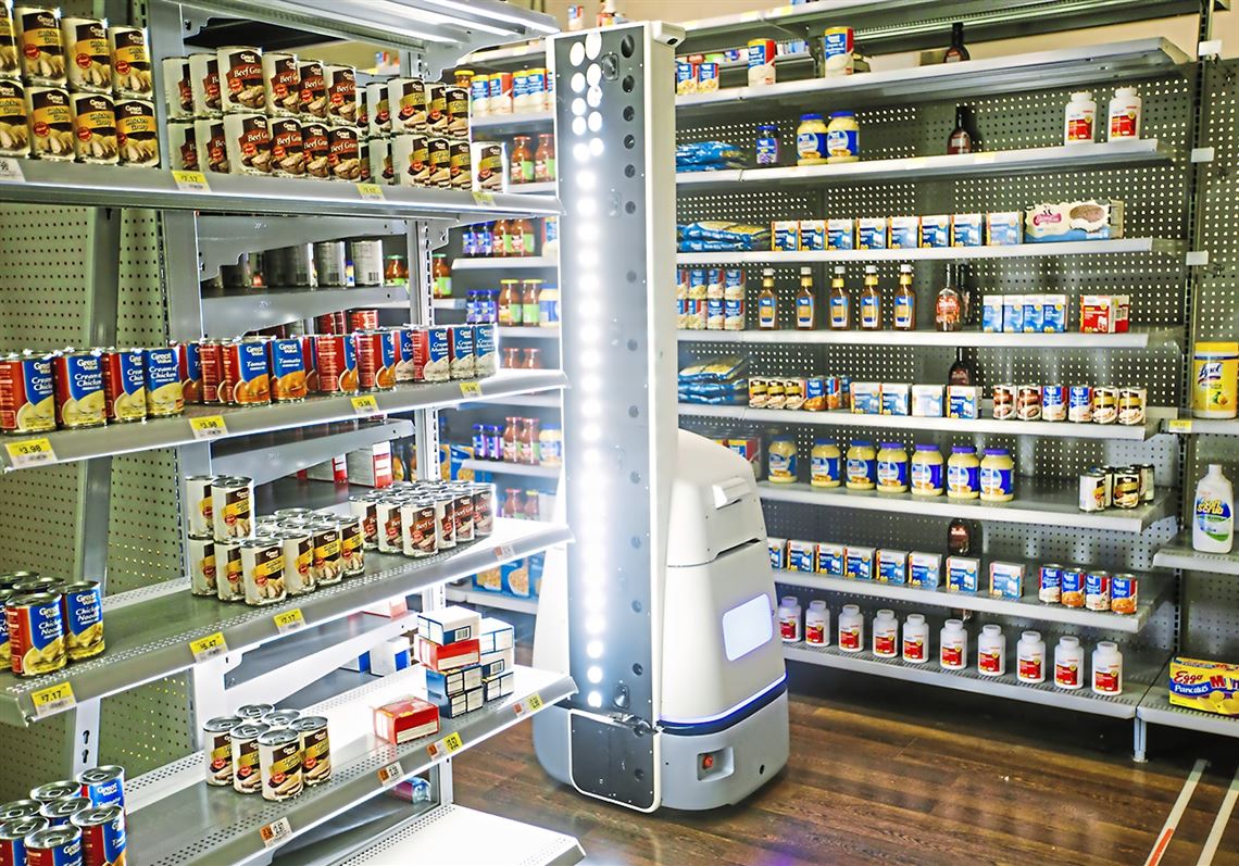 A robot made by Bossa Nova Robotics checks inventory in a mockup Wal-Mart aisle at the company's test lab on Friday, November 3, 2017 in the Strip District.