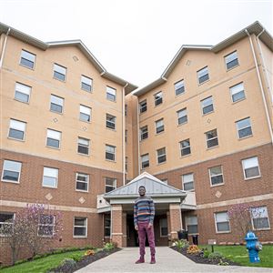 Robert Morris University student Zaithwa Gwaza poses for a portrait outside his dorm on Thursday, April 9, 2020, at Robert Morris University in Moon. Gwaza is from Malawi and could not afford a last-minute 21-hour flight home once news of the COVID-19 pandemic and stay-at-home orders broke. Gwaza needed to be back in Pittsburgh by May anyway and feared he would not be allowed to re-enter the U.S. (Steph Chambers/Post-Gazette) #pgcovid19