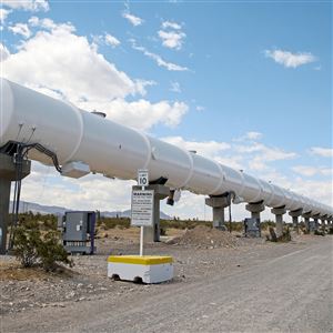 The 500 meter or .31 mile test tube for the Virgin Hyperloop One pod stretches out along a wide gravel road on the north end of the testing facility in the Mojave Desert Friday May,18, at the Virgin Hyperloop One testing facility in Apex, Nev.