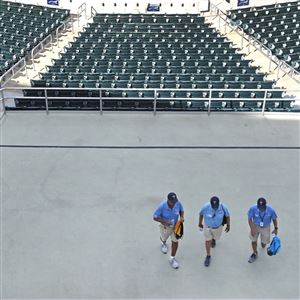 Ushers leave empty Hammond Stadium, after a baseball game between the Minnesota Twins and the Baltimore Orioles was canceled, Thursday, March 12, 2020, in Fort Myers, Fla. 