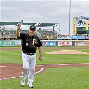 Bill Mazeroski acknowledges the crowd after delivering the lineup card to the umpires before the Pirates play the Red Sox in February at LECOM Park in Bradenton, Fla.
