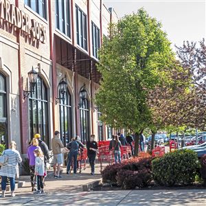 People wait to enter Trader Joe's, Thursday, May 7, 2020, in East Liberty. Walnut Capital has acquired the Village of Eastside, a nine-acre shopping center next to Bakery Square that is home to Trader Joe’s, Staples, and other retailers. 