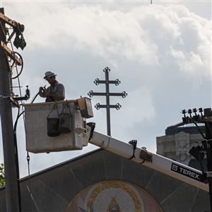 Mike Joyce, a journeyman underground splicer with Duquesne Light, works on a utility poll on Friday, May 15, 2020, in Oakland. 