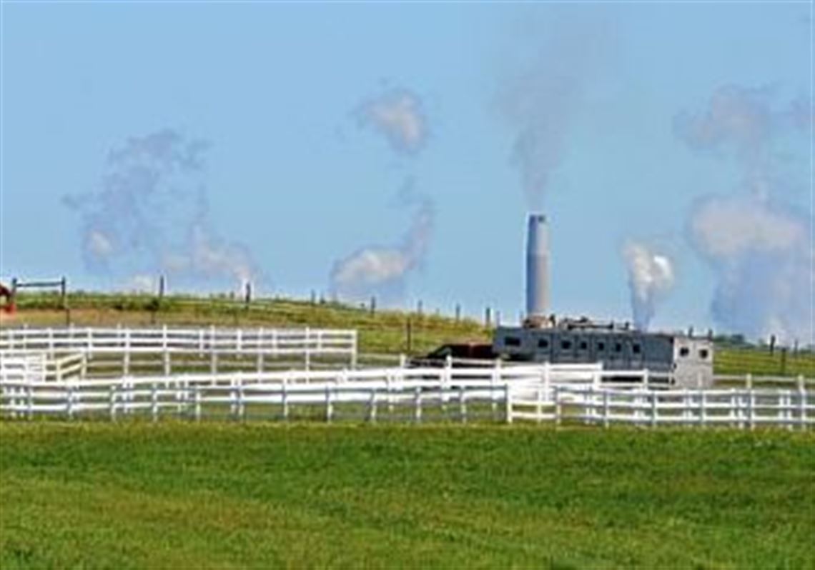 Plumes of emissions from FirstEnergy Corp's Bruce Mansfield coal-fired power plant in Shippingport, Beaver County, are visible behind a horse farm in nearby Hookstown. The emissions are checked every Monday afternoon by Dale Vineyard, below, a "smoke reader" for Grace Consulting Inc., an emissions testing services company from Wellington, Ohio.
