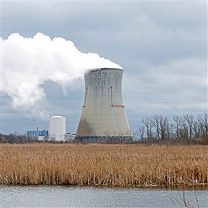 In this April 4, 2017, photo, plumes of steam drift from the cooling tower of FirstEnergy Corp.'s Davis-Besse Nuclear Power Station in Oak Harbor, Ohio.