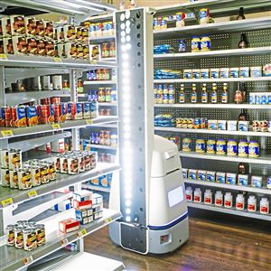 A robot made by Bossa Nova Robotics checks inventory in a mockup Wal-Mart aisle at the company's test lab in 2017 in the Strip District. 