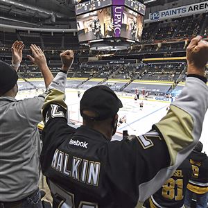 Fans cheer on the Penguins as they come onto the ice to play the Flyers on Tuesday, March 2, 2021, at PPG Paints Arena in Downtown.
