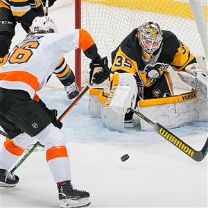 Penguins goaltender Tristan Jarry makes save on Flyers left wing Joel Farabee Tuesday, March. 2, 2021, at PPG Paints Arena in Pittsburgh. 