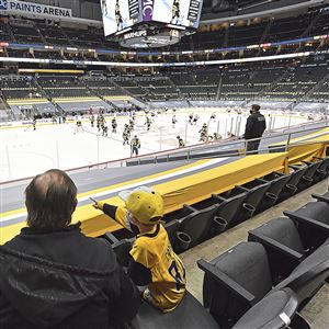 Bruce Barron enjoys the Penguins game with grandson Owen Tuesday, March. 2, 2021, at PPG Paints Arena in Pittsburgh.   
