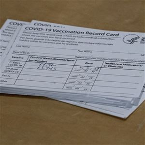 A COVID-19 vaccination card with the date, vaccine type and batch number is seen at a pop-up COVID-19 vaccination site in Brooklyn, N.Y.