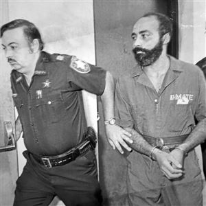 Edward Surratt is led to a hearing by sheriff's Deputies Ronald Bochenek, left, and Ben Tillman in an archive photo.