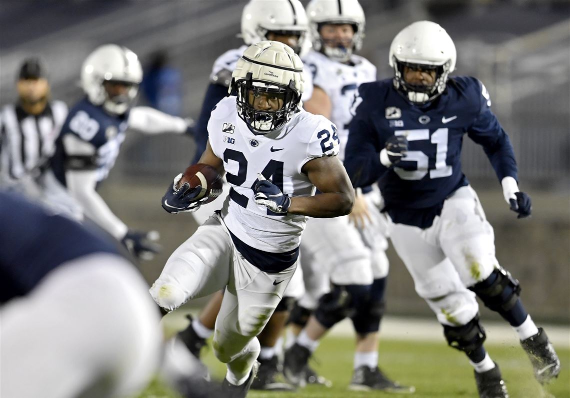 Penn State running back Keyvone Lee runs with the ball down the field during football practice, Friday, April 23, 2021 at Beaver Stadium in State College, Pa.. 