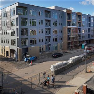 New developments rise above Waterfront Place in Pittsburgh’s Strip District on Tuesday, June 29, 2021. 