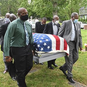 The casket carrying the body of World War II veteran Henry Parham is taken to the burial site Monday, July 12, 2021, at Allegheny Cemetery in Lawrenceville. 